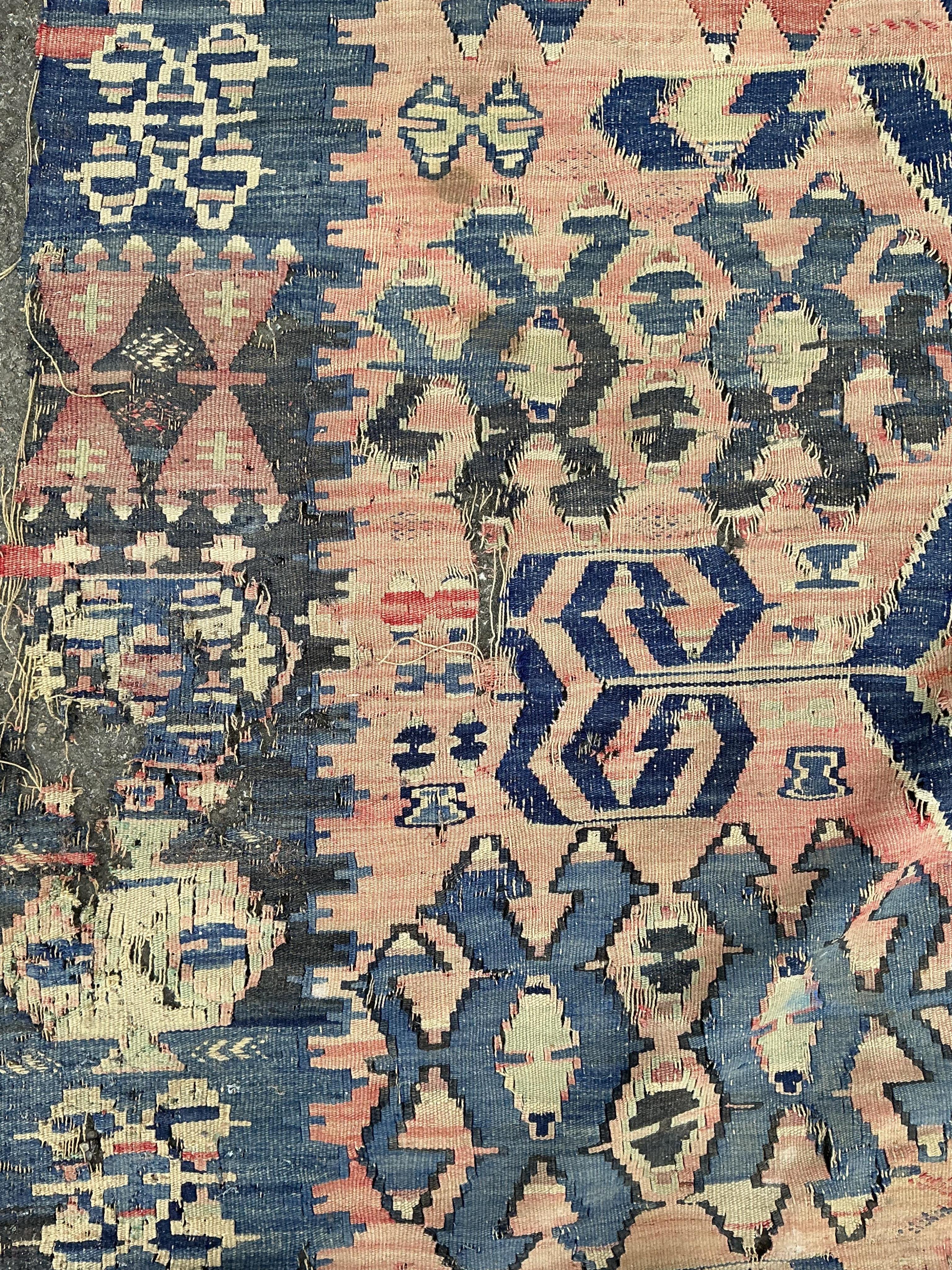 A Kilim polychrome flatweave carpet, 298 x 199cm